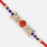 Silver Designer Fancy Rakhi with Red and Blue Jewels