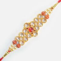 Awesome Looking Transparent and Red Jewel Studded Golden Color Amazing Jewel Rakhi