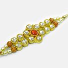 Awesome Looking Transparent and Red Jewel Studded Golden Color Amazing Jewel Rakhi