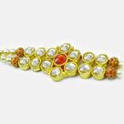 Awesome Looking Transparent and Red Jewel Studded Golden Color Amazing Jewel Rakhi