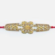 Uniquely Crafted Golden Color Jewel Studded Marvelous Designer Rakhi