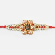 Swastika On Gold Base Pearl and Jewel Studded Attractive Looking Jewel Rakhi