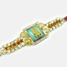 Divine Ganesha Photo In Mid of Golden Base Attractive Looking Stunning Jewel Rakhi