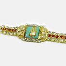 Divine Ganesha Photo In Mid of Golden Base Attractive Looking Stunning Jewel Rakhi