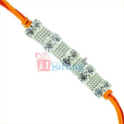 Ultimate Carved Creation - Diamond Rakhi in Moli with Silver Net Base