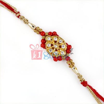 Inspiring Golden Base Diamond Rakhi with Red and Golden Beads
