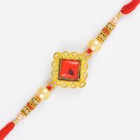 Craftly Designed Golden Base Moli Rakhi with Kundan Stones