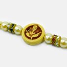Shri Ganesha On Circular Base Pearl and Jewel Mauli Amazing Rakhi