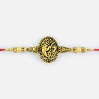 Attractive Looking Golden Ganesha Pearl Rakhi with Beads