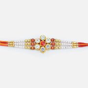 Tremendous Floral Shape Central Studded Diamond Pearl Rakhi