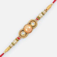 Spectacular Golden Designed Embossed Pearl Rakhi