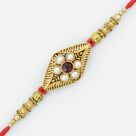 Nicely Designed Pearl Rakhi with Golden Work