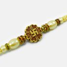 Marvelous Looking Swastika on Flower Auspicious Stunning Pearl Rakhi