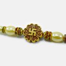 Marvelous Looking Swastika on Flower Auspicious Stunning Pearl Rakhi