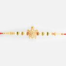 Om Written on Golden Tortoise Divine Beaded Peal Rakhi for Brother