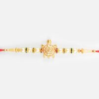 Om Written on Golden Tortoise Divine Beaded Peal Rakhi for Brother