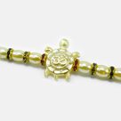 Om Written on Golden Tortoise Divine Beaded Peal Rakhi for Brother