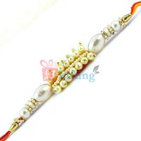 A Fine Fresh Special Designer Pearl Rakhi in Mauli Dori for Brother