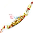 Candid Clean Diamond Pearl Beads Rakhi in Golden Designer Base