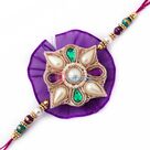 Enticing kundan and crystals in pearl Rakhi