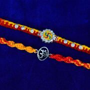 Swastika Jewel Studded and Sacred Om Pure Silver Brother Rakhi Set of 2