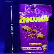 Nestle Munch Chocolate with Simple Amazing Looking Pure Silver Rakhi