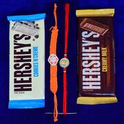 Hexa and Coin Shape Mauli Thread Silver Rakhis with Hersheys Cookies and Creamy Milk Chocolate