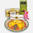Amazing Yellow Base Rakhi Puja Thali with Chocolates and Ganesha Rakhi for Brother