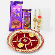 Dairy Milk Fruit and Nut and Roast Almonds Chocolate with Rakhis and Auspicious Pooja Thali