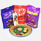 Dairy Milk Kitkat and Much Pack of Chocolates Hamper with Rakhis and Divine Puja Thali