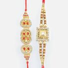 Red and White Stone Studded Golden Base Fine Work Fantastic Designer Rakhis Set of 2