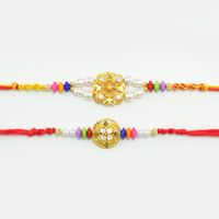 Golden Color Rakhi with Multicolor Beads