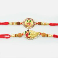 Beautiful designer Golden Ganesha Rakhi with Rudraksh And Pearls