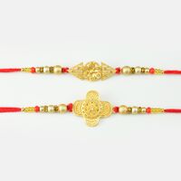 Golden Color Rakhi In Pearls And Diamonds