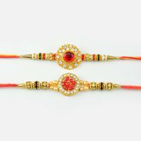Coin Designer Swastik Rakhi with Pearls And Diamonds