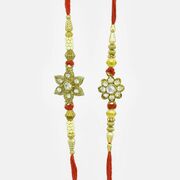 Floral motifs in mid with Ivory Seed Bead Rakhi Pair for Brother