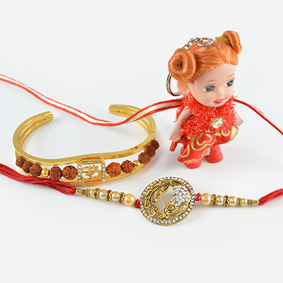 Golden Diamond Studded Peacock and Divine Rudraksha Bracelet with Cute Doll Rakhi Set of 3 