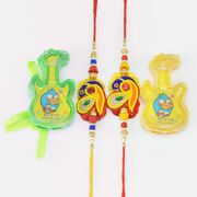 Two Guitar Toy Kid Rakhis with Two Peacock Shape Zardosi Brother Rakhis Set of 4