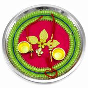 Small Ganesha Below Golden Leaf on Pink Color Base Rakhi Puja Thali
