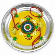 Green Sparkling Stones on Yellow Painted Rakhi Pooja Thali