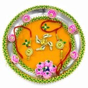 Lord Ganesha on Swastik Decorated with Kodi, Pink Roses, and Bordered with Sparkling Lace Rakhi Pooja Thali