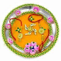 Lord Ganesha on Swastik Decorated with Kodi, Pink Roses, and Bordered with Sparkling Lace Rakhi Pooja Thali
