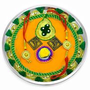 Orange Background Ganesha Rakhi Pooja Thali with Green Lace