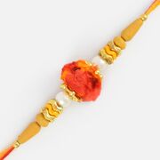 Awesome Looking Golden Cutting Bead Sandalwood Rakhi