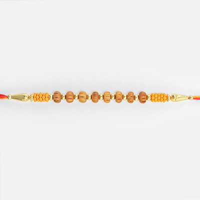 Liner Rakhi Made from Small Sandalwood Beads On Sacred Mauli Rakhi