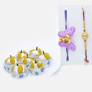 Ganesha Engraved Rakhi and Kids Rakhi Set of 2 with Tasty Kaju Badam Laddu