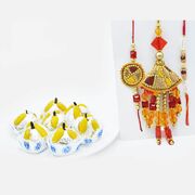 Magnificient Rakhi Set of 3 with Kaju Badam Laddu