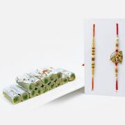 Playing Golden Kanha and Elegant Rakhi Set of 2 with Savory Kaju Pista Roll