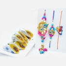 Delicious Kaju Raj Bahar with Zardozi Designer Bhaiya-Bhabhi Rakhi Set and Minions in Car Kids Rakhi