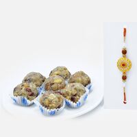 Divine Golden Rudraksha Rakhi with Dry Fruit Laddu